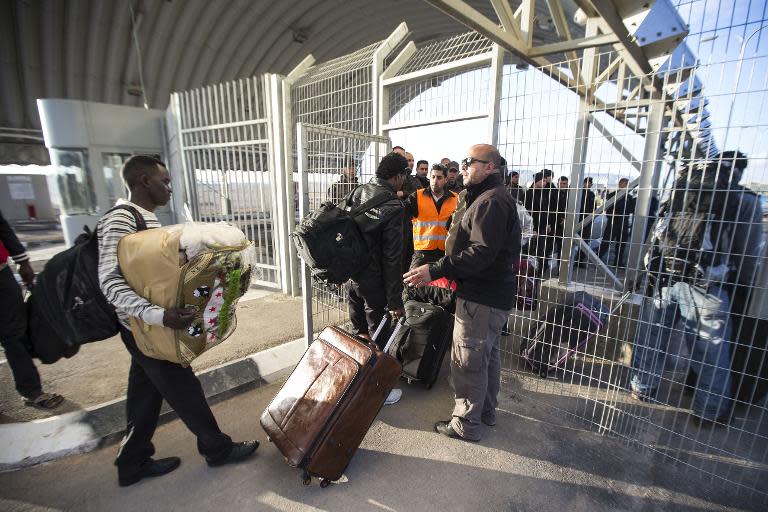 African asylum seekers, who entered Israel illegally via Egypt, enter the Holot detention centre in Israel's southern Negev Desert, on February 17, 2014