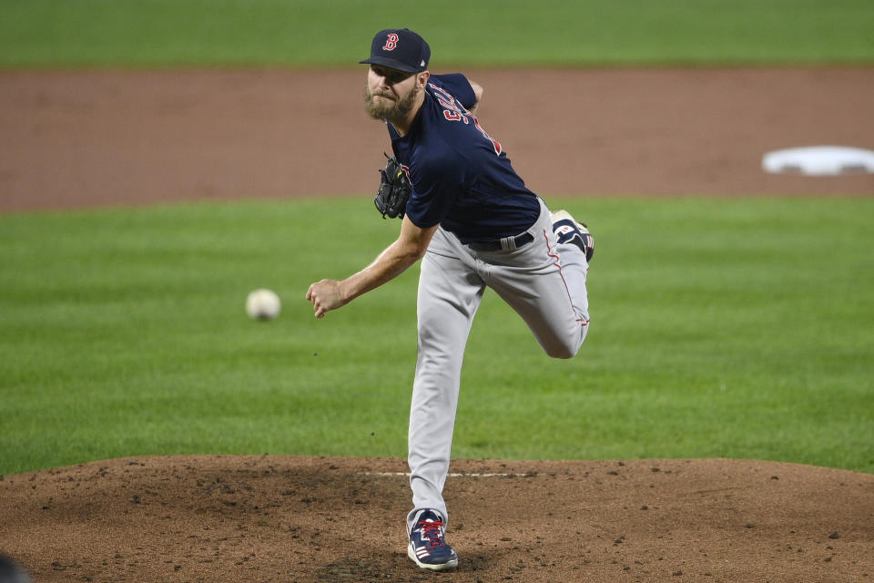 Boston Red Sox starting pitcher Chris Sale follows through on a pitch during the first inning of a baseball game against the Baltimore Orioles, Tuesday, Sept. 28, 2021, in Baltimore. (AP Photo/Nick Wass)