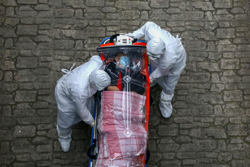 coronavirus covid 19 patient emergency workers protective equipment suits masks gloves south korea march 9 2020 GettyImages 1211268635