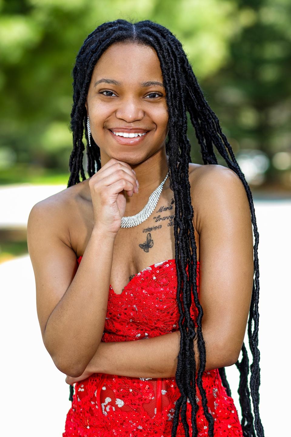 Howard High School of Technology senior Taral Mable-Pearson, 18, of Newark, will attend prom at the Inn At Mendenhall in Chadds Ford, Pennsylvania, on May 27. Mable-Pearson is pictured wearing a red dress priced around $1,000 that she borrowed from her best friend's mom's daughter on April 24. She she's still considering whether to wear this dress or the black one to prom.