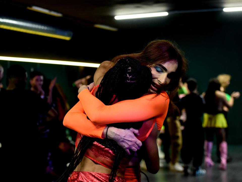 Voguers hug on stage after their performance in Madrid 2021