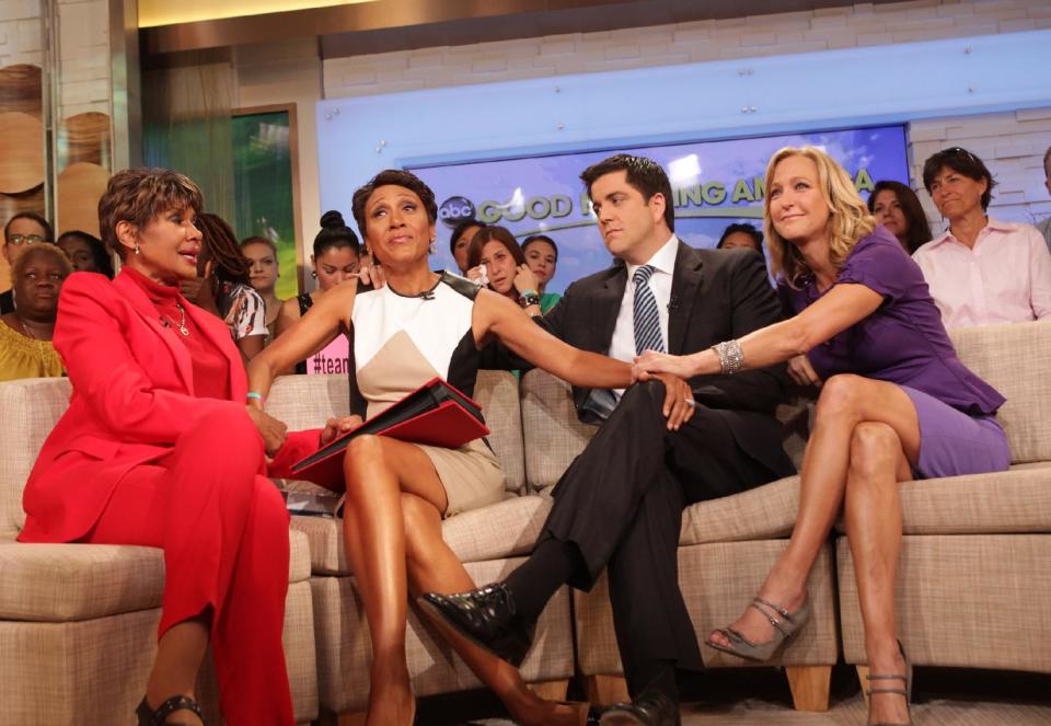 This image released by ABC shows "Good Morning America" co-host Robin Roberts, second left, with her sister Sally-Ann Roberts, left, and co-hosts Josh Elliott and Lara Spencer, right, on the popular morning show on Thursday, Aug. 30, 2012 in New York. Roberts has said goodbye to "Good Morning America," but only for a while. The "GMA" anchor made her final appearance Thursday before going on medical leave for a bone marrow transplant. Roberts' departure was first planned for Friday, but she chose to exit a day early to visit her ailing mother in Mississippi. In July she first disclosed that she has MDS, a blood and bone marrow disease. She will be hospitalized next week to prepare for the transplant. The donor will be her older sister, Sally-Ann Roberts. (AP Photo/ABC, Fred Lee)