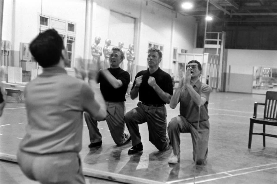 Not published in LIFE. Kirk Douglas and Burt Lancaster with choreographer Jack Cole, practicing a mock-bitter song-and-dance number called "It's Great Not to Be Nominated"; the tune ribbed many of the year's Oscar contenders. (Leonard McCombe—TIME & LIFE Pictures/Getty Images) <br> <br> <a href="http://life.time.com/culture/oscars-rare-photos-from-academy-award-rehearsals-1958/#1" rel="nofollow noopener" target="_blank" data-ylk="slk:Click here to see the full collection at LIFE.com;elm:context_link;itc:0;sec:content-canvas" class="link ">Click here to see the full collection at LIFE.com</a>