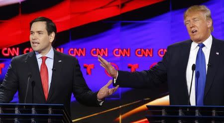 Republican U.S. presidential candidates Marco Rubio (L) and Donald Trump speak simultaneously at the debate sponsored by CNN for the 2016 Republican U.S. presidential candidates in Houston, Texas, February 25, 2016. REUTERS/Mike Stone
