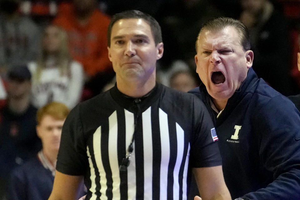 Illinois head coach Brad Underwood yells at referee Brian McNutt during the first half of an NCAA college basketball game against Penn State Saturday, Dec. 10, 2022, in Champaign, Ill. (AP Photo/Charles Rex Arbogast)