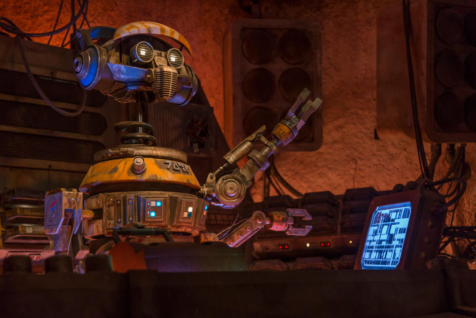 This former Star Tours pilot droid, known as “Rex,” crash landed on Batuu and was reprogrammed. “DJ Rex” now provides the musical entertainment inside Oga’s Cantina (Joshua Sudock/Disney Parks)