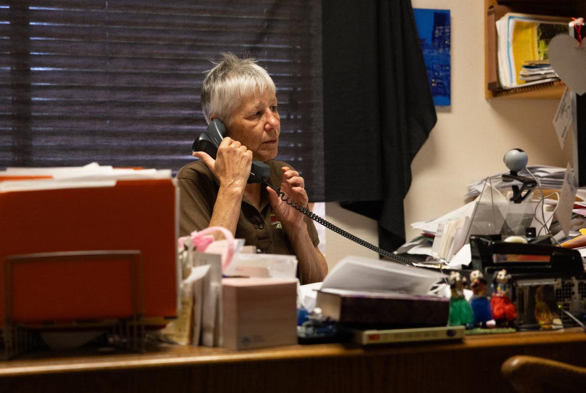 Librarian Judy Bergeron answers the phone in her office at the Smithville Public Library in Smithville, Texas on Mar. 11, 2024. Bergeron and her team participated in the It's Time Texas Community Challenge where her and her team worked for eight weeks on this challenge by logging hours of healthy activities and would push each other to do self care and community events such as getting together to exercise and eat healthy meals. Smithville won for the statewide extra small community a seventh year in a row.