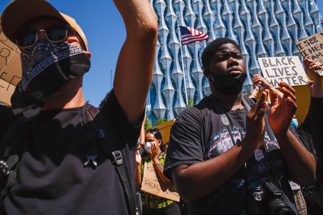  Activists gathered chanting slogans at the US embassy during the George Floyd demonstration. Thousands came together for the protest, despite ongoing concerns over the possible spread of coronavirus and continuing calls by authorities for social distancing guidelines to be adhered to. Floyd, a black man, died as a white police officer, Derek Chauvin, knelt on his neck during an arrest in the US city of Minneapolis on May 25. Floyd's death, reminiscent of the chokehold death of Eric Garner at the hands of police officers in New York in 2014, has reignited the 'Black Lives Matter' movement against police brutality in the US, and left Minneapolis and major cities from coast to coast reeling from nights of rioting. (Photo by David Cliff / SOPA Images/Sipa USA) 