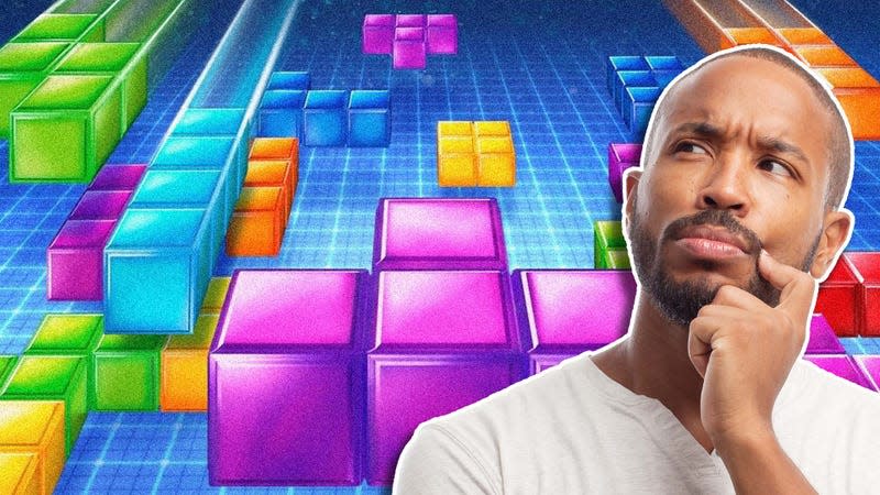 An image shows a man pondering something in front of Tetris blocks. 