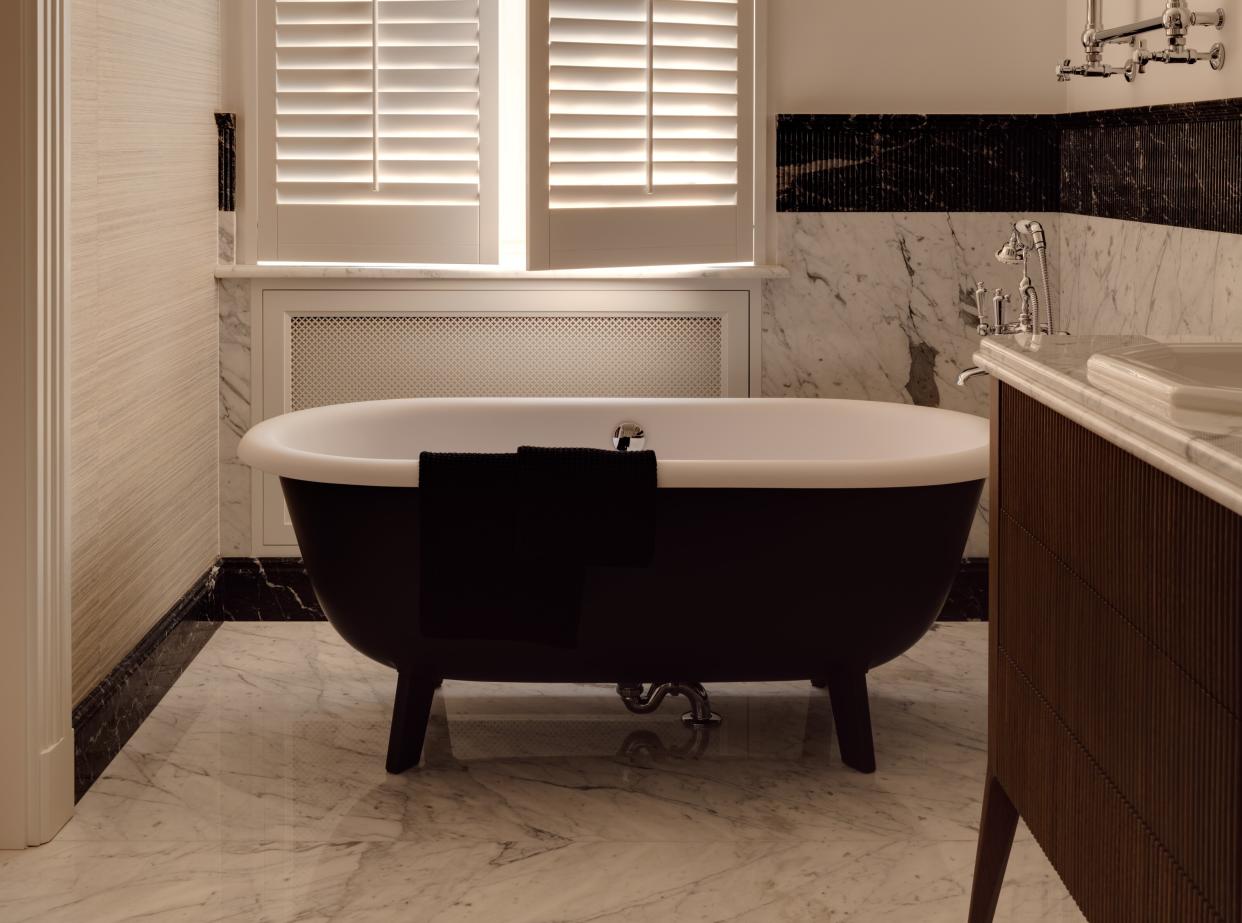  A family bathroom with freestanding bath. 