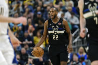 FILE - In this Feb. 12, 2020, file photo, Milwaukee Bucks forward Khris Middleton (22) is shown in action during an NBA basketball game against the Indiana Pacers in Indianapolis. The Milwaukee Bucks have established an emergency relief fund for part-time employees of FiServ Forum, the team’s home arena. The Bucks Emergency Relief Fund will provide financial relief for part-time employees of the arena’s food and beverage provider, housekeeping employer and parking partners. NBA MVP Giannis Antetokounmpo and All-Star forward Khris Middleton have contributed $100,000 each. (AP Photo/AJ Mast, File)