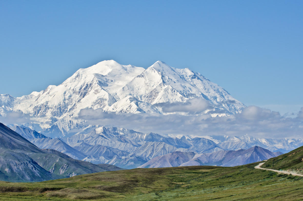 A view of Denali, formerly Mount McKinley,&nbsp;in Denali National Park, Alaska, with Park Road in the foreground leading to it. (Photo: elmvilla via Getty Images)