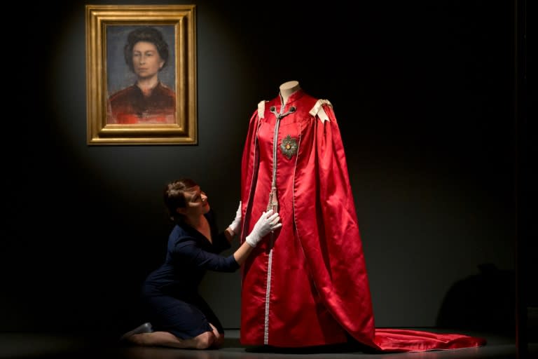 A picture shows exhibits on display at the "Fashioning a Reign: 90 Years of Style from The Queen's Wardrobe" exhibition inside Buckingham Palace in London on July 21, 2016