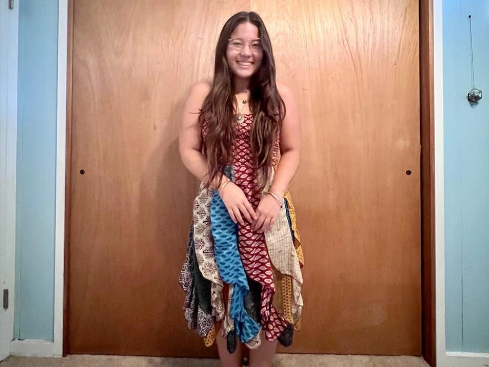 Ashley wearing a patterned, colorful dress