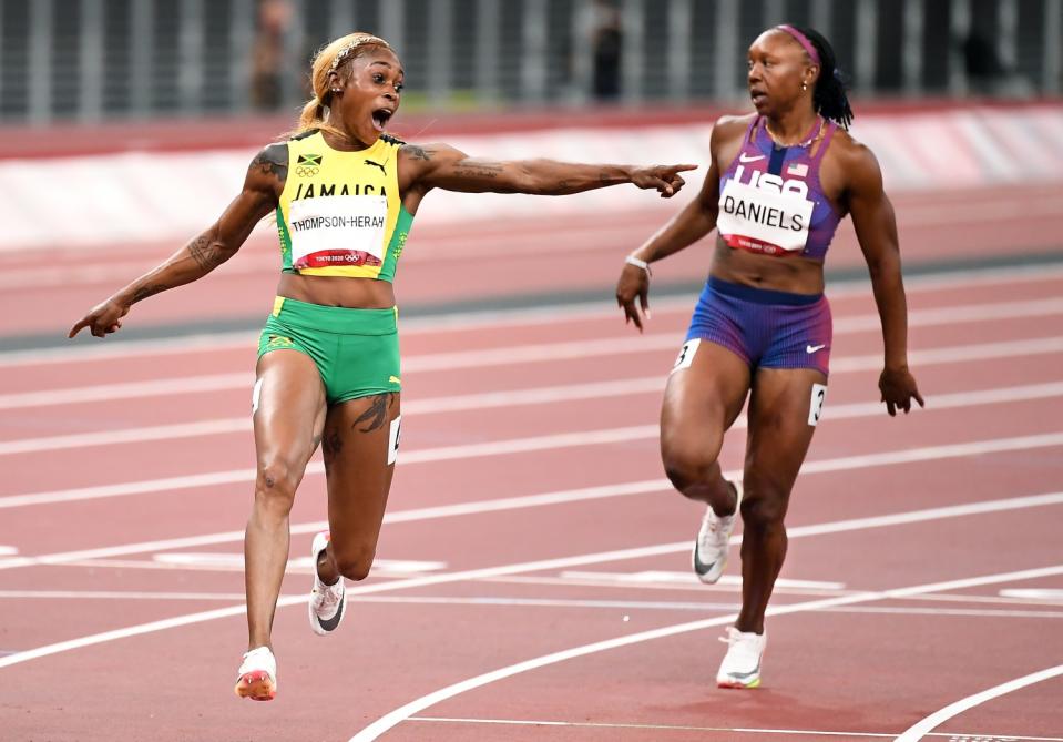 Jamaica's Elaine Thompson-Herah, USA's Teahna Daniels in the 100m final