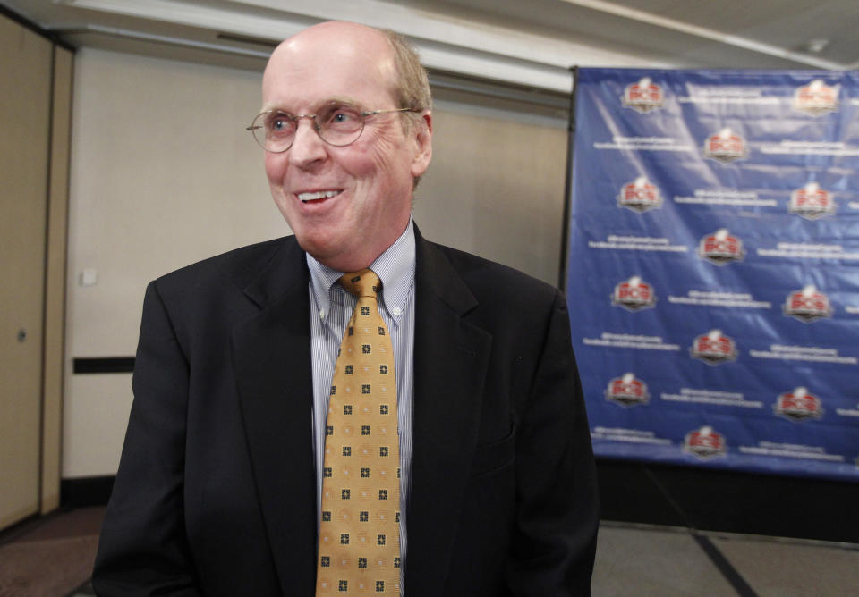 Bill Hancock, BCS executive director, smiles during an interview after a BCS presidential oversight committee meeting and media availability, Tuesday, June 26, 2012, in Washington. The committee announced a new post-season format for a four-team playoff for the major college football national championship. (AP Photo/Alex Brandon)