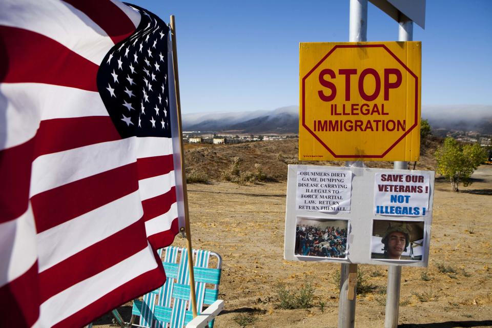 Placards against the possible arrival of undocumented migrants who may be processed at the Murrieta Border Patrol Station are seen during a picket in Murrieta, California July 1, 2014. (REUTERS/Sam Hodgson)