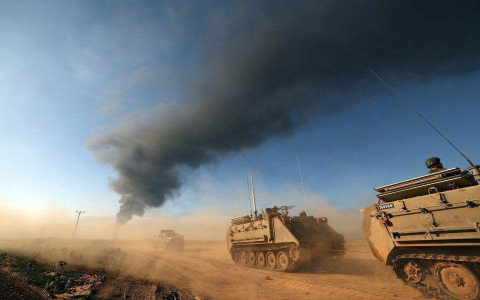 Israeli soldiers patrolling along the southern part of the border with the Gaza Strip