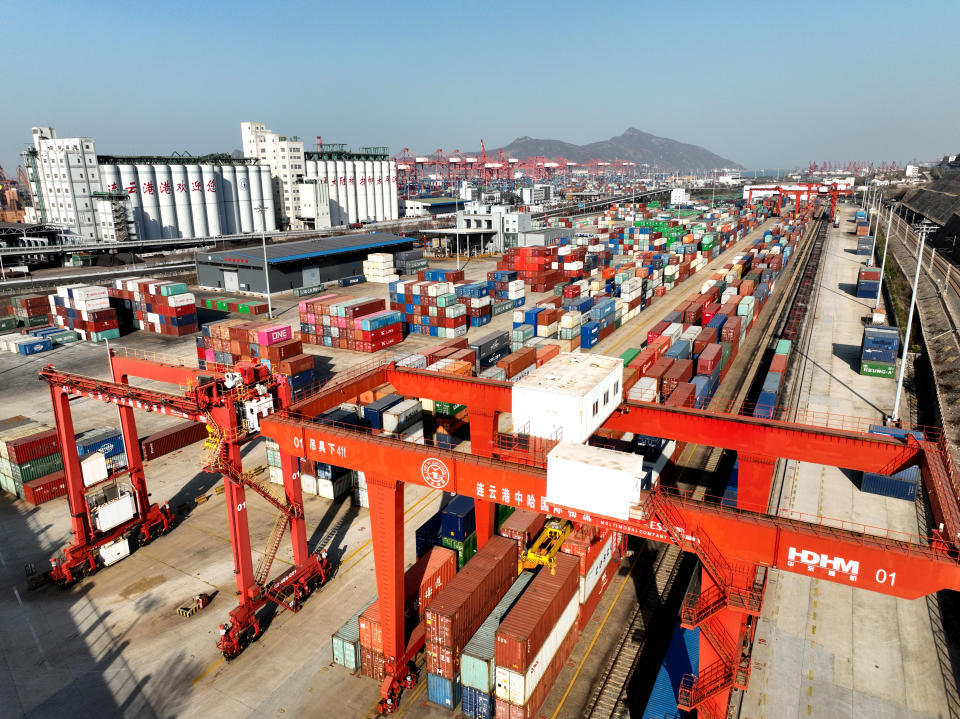 LIANYUNGANG, CHINA - MARCH 14, 2023 - Large machinery loads containers at the China-Kazakhstan logistics Cooperation Base in Lianyungang, East China's Jiangsu province, March 14, 2023. On the same day, as the first physical platform project of the Belt and Road international economic and trade cooperation, the China-Kazakhstan (Lianyungang) logistics cooperation Base has shipped 5,000 China-Europe freight trains, handling more than 440,000 TEUs. Six freight train routes have been extended from five Central Asian countries to Turkey, Germany, Russia and other countries, covering 104 international freight stations. (Photo credit should read CFOTO/Future Publishing via Getty Images)