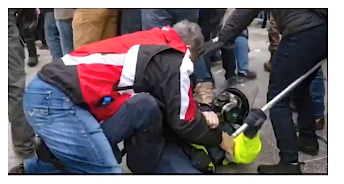 Evidence photo of Thomas Webster and a police officer at the Capitol riot. (Photo: Evidence photo of Thomas Webster and police officer submitted with indictment against him.)