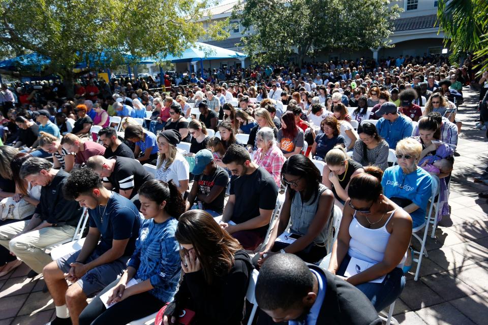 Mourners gather during a prayer vigil.