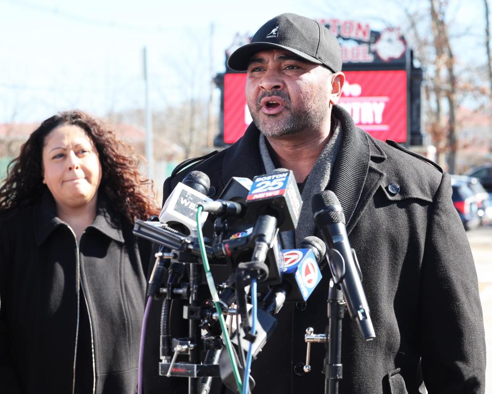 School committee members Tony Rodrigues, right, with Joyce Asack, left, speaks during a presser with fellow school committee members Claudio Gomes and Ana Oliver (not in photo) at Brockton High School on Monday, Feb. 19, 2024 regarding their request that the National Guard be deployed at the school amid reports of high levels of violence and turmoil.