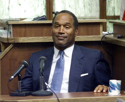 397272 06: (FILE PHOTO) Former NFL star and actor O.J. Simpson testifies in Miami-Dade County Court during his “road rage” trial October 23, 2001 in Miami, Florida. U.S. Federal agents searched Simpson’s home near Miami December 4, 2001 during an investigation into an Ecstasy drug ring and the theft of equipment used to steal satellite television signals. Simpson had not been arrested or indicted. (Pool Photo/Getty Images)