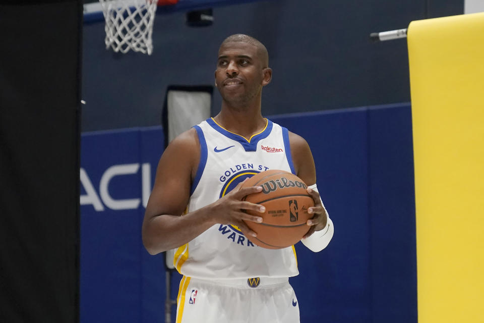 Golden State Warriors' Chris Paul poses for photos during the NBA basketball team's media day in San Francisco, Monday, Oct. 2, 2023. (AP Photo/Jeff Chiu)