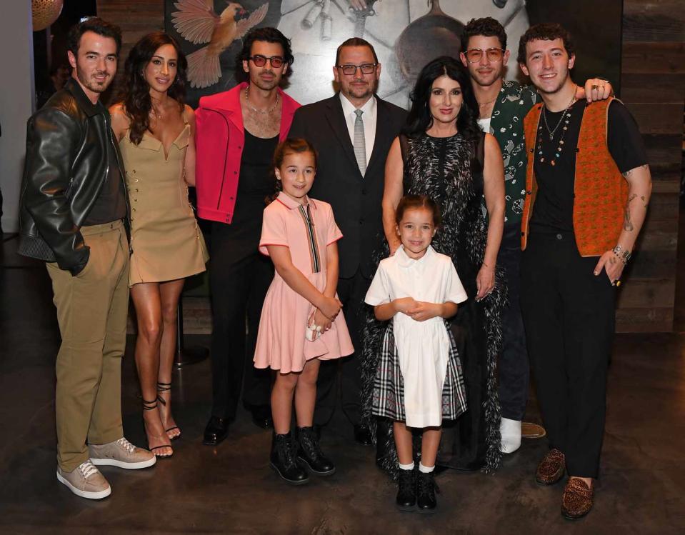 Kevin Jonas, Danielle Jonas, Joe Jonas, Kevin Jonas Sr., Denise Jonas, Nick Jonas, Frankie Jonas, (Bottom Row) Alena Rose Jonas and Valentina Angelina Jonas arrive at the grand opening of their family restaurant Nellie's Southern Kitchen at MGM Grand on June 04, 2022 in Las Vegas, Nevada.