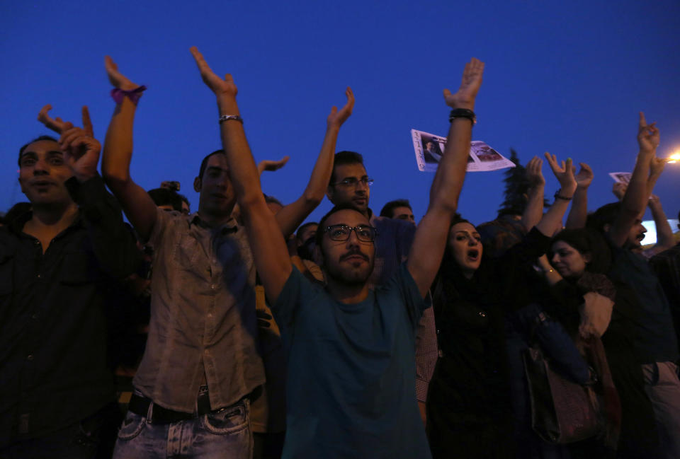 Iranians gather as they celebrate the victory of moderate presidential candidate Hassan Rouhani in the presidential elections at Vanak Square, in northern Tehran, on June 15, 2013. (ATTA KENARE/AFP/Getty Images)