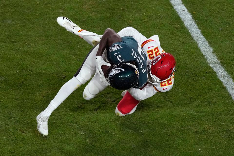 Kansas City Chiefs safety Juan Thornhill tackles Philadelphia Eagles wide receiver Zach Pascal (3) during the second half of the NFL Super Bowl 57 football game, Sunday, Feb. 12, 2023, in Glendale, Ariz. (AP Photo/Charlie Riedel)