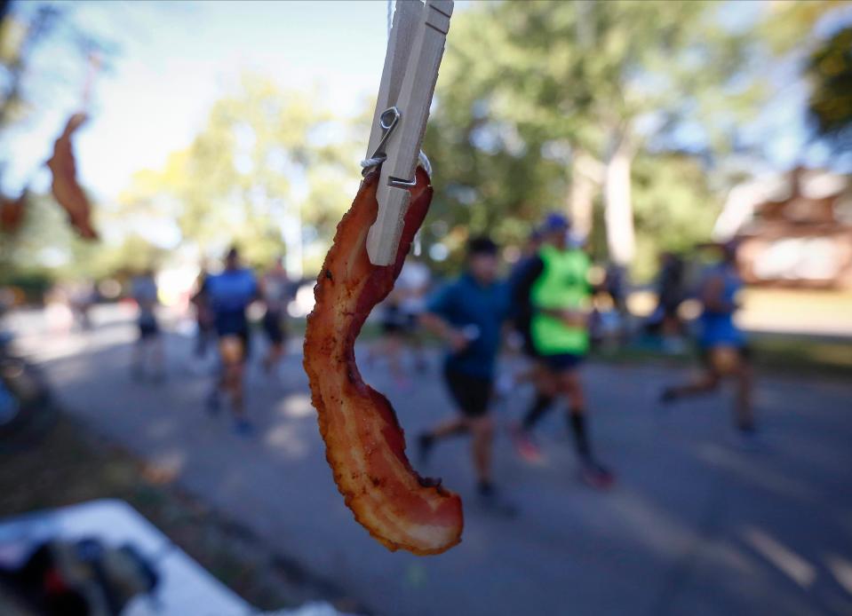 Bacon is fed to runners at an American marathon.