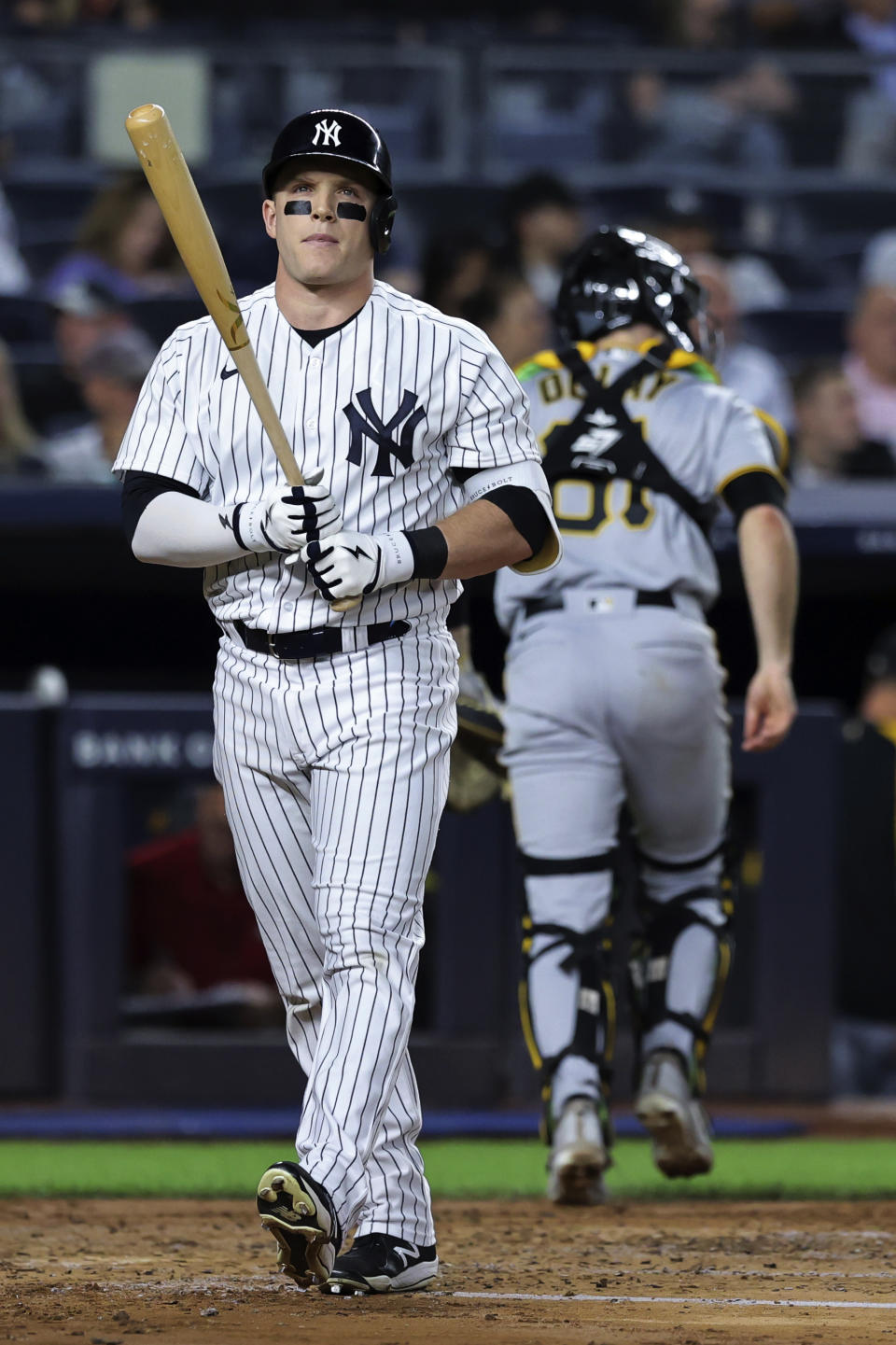 New York Yankees' Harrison Bader reacts after striking out against Pittsburgh Pirates starting pitcher Luis Ortiz, as catcher Jason Delay (61) runs to the dugout during the second inning of a baseball game Tuesday, Sept. 20, 2022, in New York. (AP Photo/Jessie Alcheh)
