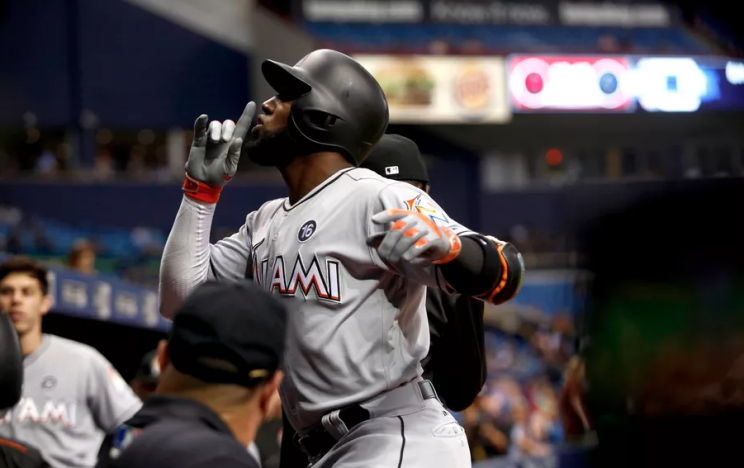 ST. PETERSBURG, FL - MAY 3: Marcell Ozuna #13 of the Miami Marlins celebrates his home run as he makes his way back to the dugout during the fourth inning of a game against the Tampa Bay Rays on May 3, 2017 at Tropicana Field in St. Petersburg, Florida. (Brian Blanco/Getty Images)