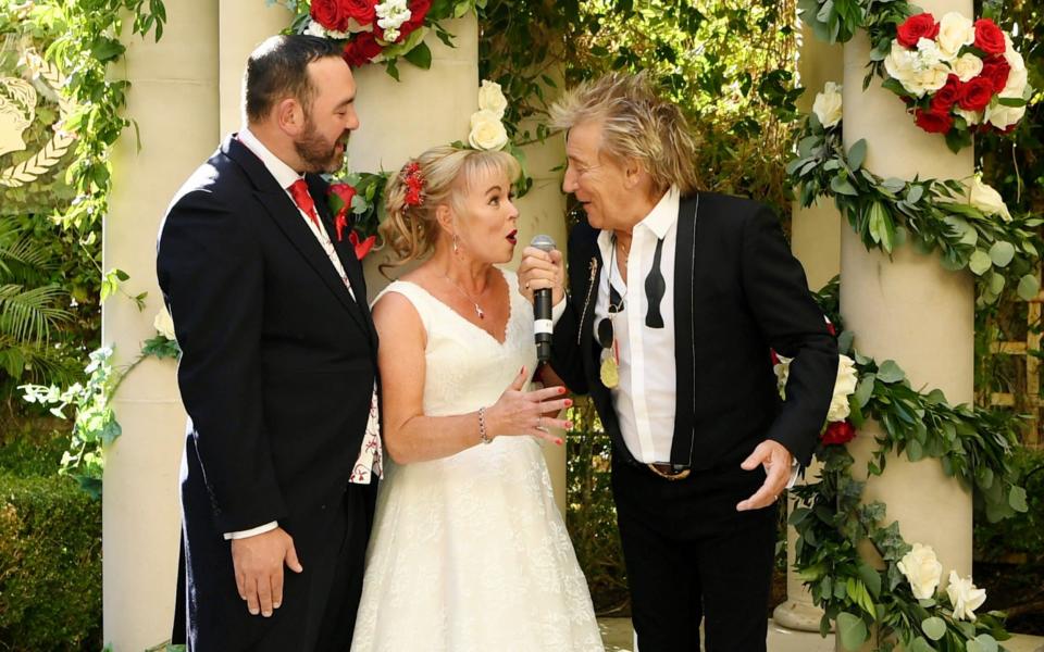 Sir Rod Stewart surprises and serenades wedding couple whose big day was almost ruined by Thomas Cook - WireImage