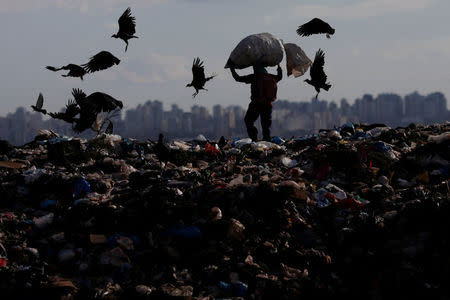 A man works at 'Lixao da Estrutural', Latin America's largest rubbish dump, in Brasilia, Brazil, January 18, 2018. Picture taken January 18, 2018. REUTERS/Ueslei Marcelino