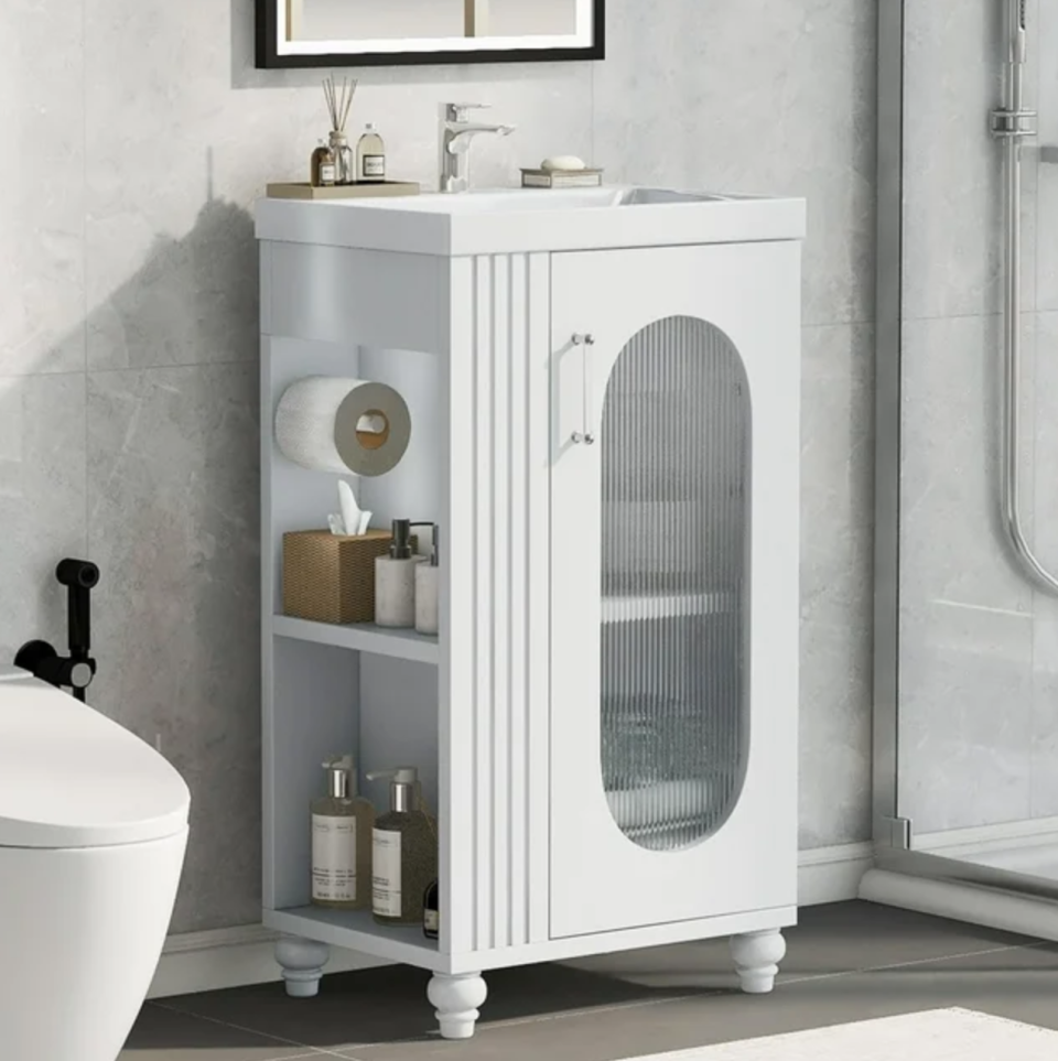 <p><a href="https://go.redirectingat.com?id=74968X1596630&url=https%3A%2F%2Fwww.walmart.com%2Fip%2FMIDODO-20-Small-Bathroom-Vanity-with-Sink-Modern-Bathroom-Cabinet-with-Paper-Holders-Wood-Bathroom-Vanity-with-Glass-Door%2F5427230805&sref=https%3A%2F%2Fwww.elledecor.com%2Fshopping%2Ffurniture%2Fg60536804%2Fbest-small-bathroom-vanities%2F" rel="nofollow noopener" target="_blank" data-ylk="slk:Shop Now;elm:context_link;itc:0;sec:content-canvas" class="link ">Shop Now</a></p><p>Small Bathroom Vanity with Sink</p><p>$164.68</p><span class="copyright">Walmart</span>