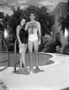 <p>A young Elizabeth Taylor and her then-fiancé William D. Pawley Jr. pose poolside at Pawley's family home in Miami, circa 1949. </p>