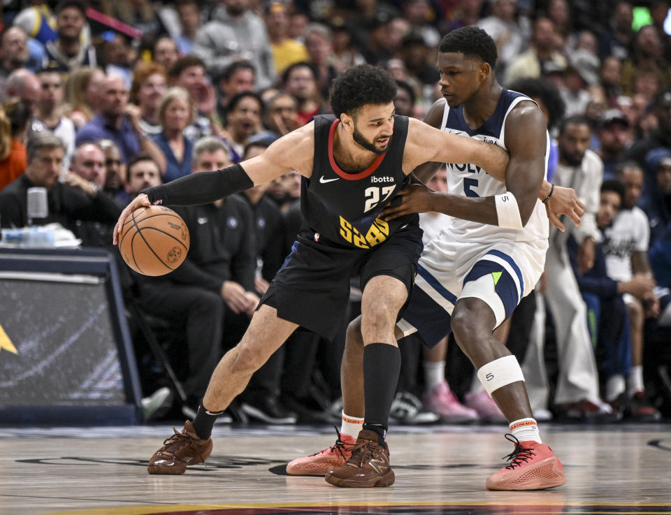 DENVER, CO - MAY 14: Jamal Murray (27) of the Denver Nuggets works against Anthony Edwards (5) of the Minnesota Timberwolves during the second quarter at Ball Arena in Denver on Tuesday, May 14, 2024. (Photo by AAron Ontiveroz/The Denver Post)