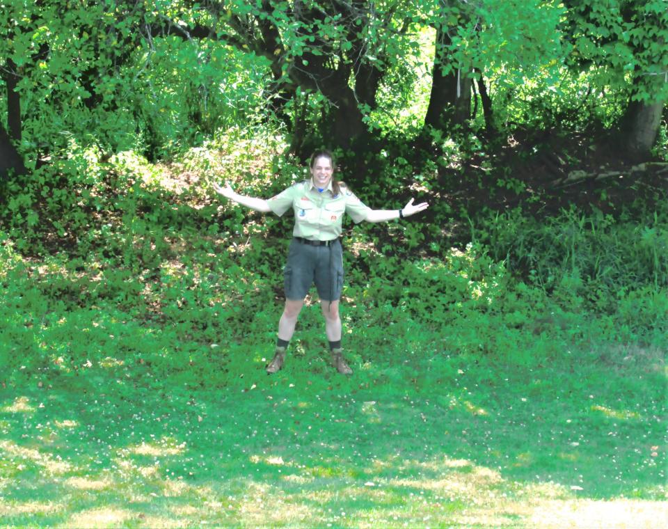 Holmes Life Scout Brenna Barbey stands where the stage of her proposed amphitheater will be at the base of the hill beyond the outfield of the Little League field at Deer Run Park.