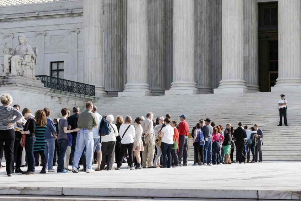 Visitors line up to enter the Supreme Court in Washington. (AP Photo/J. Scott Applewhite, File)