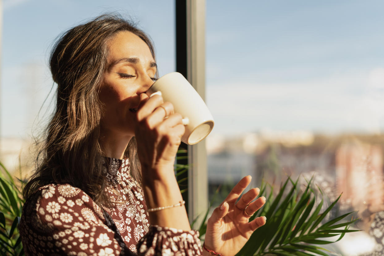 Woman enjoying a cup of tea. (Getty Images)