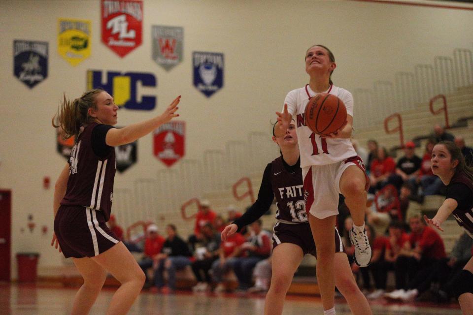 Twin Lakes junior Addie Bowsman rises with her left hand against Faith Christian during the Twin Lakes Holiday Tournament on Wednesday, Dec. 27, 2023.