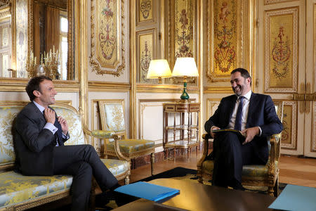 FILE PHOTO: French president Emmanuel Macron (L) speaks with Christophe Castaner, newly-elected "La Republique en Marche" (Republic on the Move, or LREM) political party leader and Junior Minister for Relations with Parliament and government spokesperson Christophe Castaner, during a meeting at the Elysee Palace in Paris, France, November 20, 2017. REUTERS/Ludovic Marin/Pool