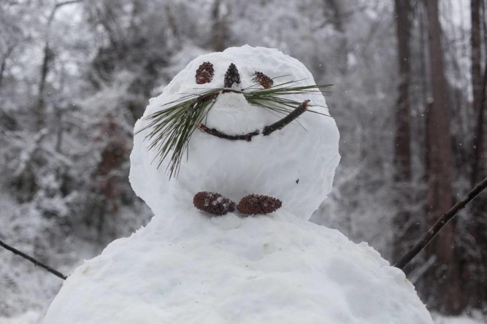 The finished snowman that is the work of Emily and Brendan Payne, Caroline and Ryan Pickens, and Nichole and Matt Horn. Morgan McCloy/mmccloy@newsobserver.com