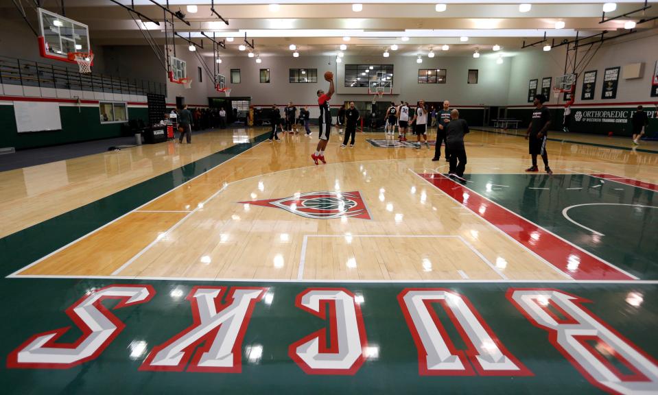 Milwaukee Bucks guard Khris Middleton shoots three-pointers during the Bucks' practice at the Cousins Center in St. Francis on April 16, 2015.