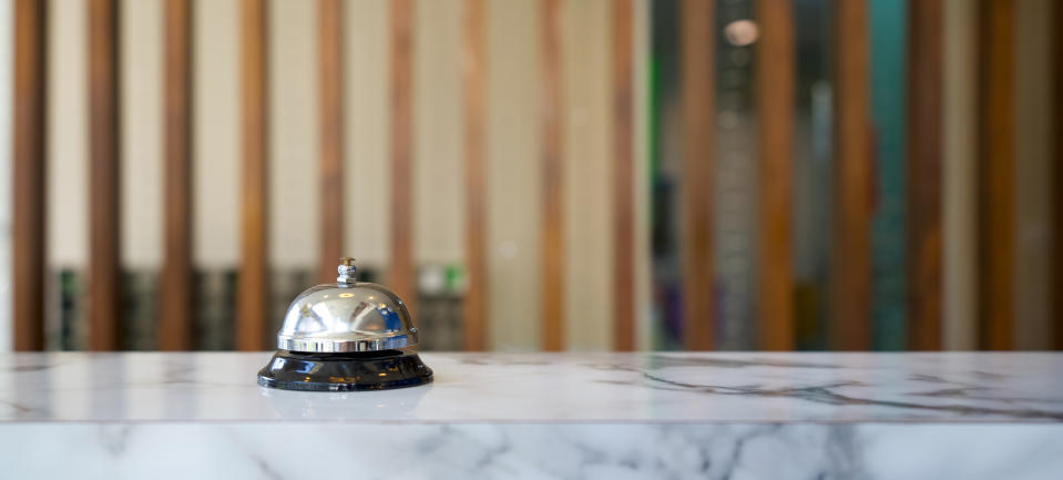 Service bell on a hotel reception desk, signifying customer service in the hospitality industry