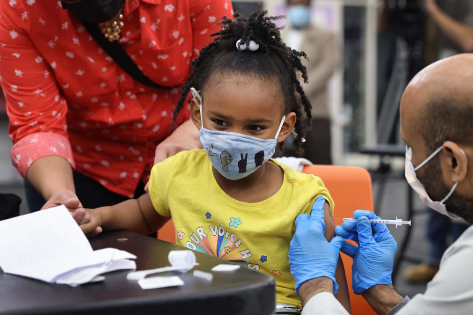 Nov. 12, 2021: A kindergarten student getting vaccinated at Michele Clark High School Chicago, Illinois. The city of Chicago closed all public schools for a “vaccination awareness day” with the hope of getting as many students as possible vaccinated against COVID-19. (Scott Olson / Getty Images)