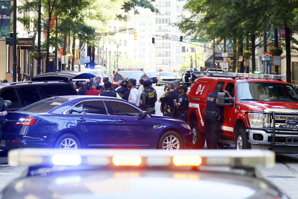 Multiple agencies work the scene where multiple people were injured Tuesday, June 11, 2024, during a shooting in a busy downtown Atlanta, food court at the Peachtree Center. (Miguel Martinez/Atlanta Journal-Constitution via AP)