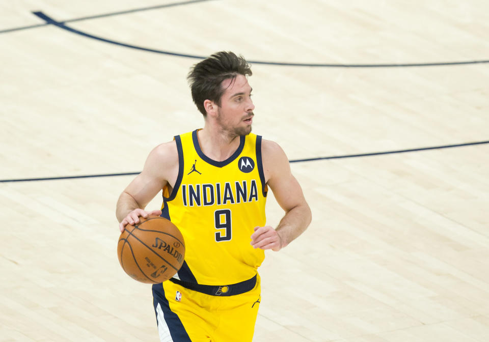 Apr 16, 2021; Salt Lake City, Utah, USA; Indiana Pacers guard T.J. McConnell (9) dribbles up the court during the second half against the Utah Jazz at Vivint Smart Home Arena. 